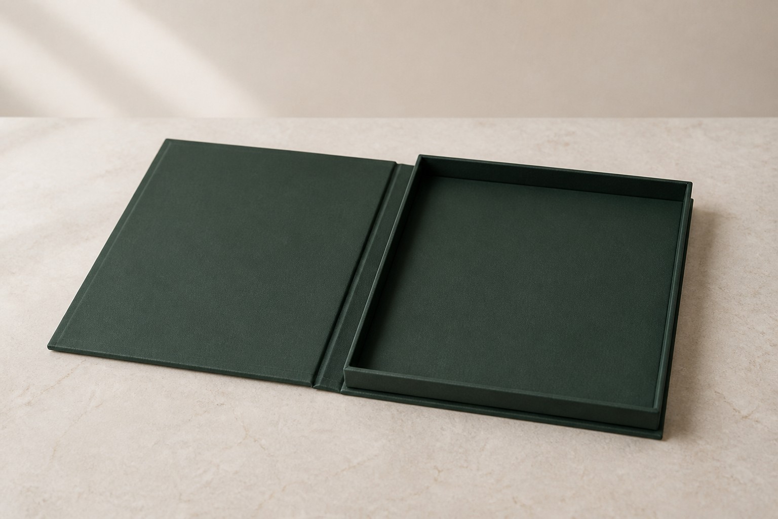 A rigid box lying open like a book on its hinged spine.