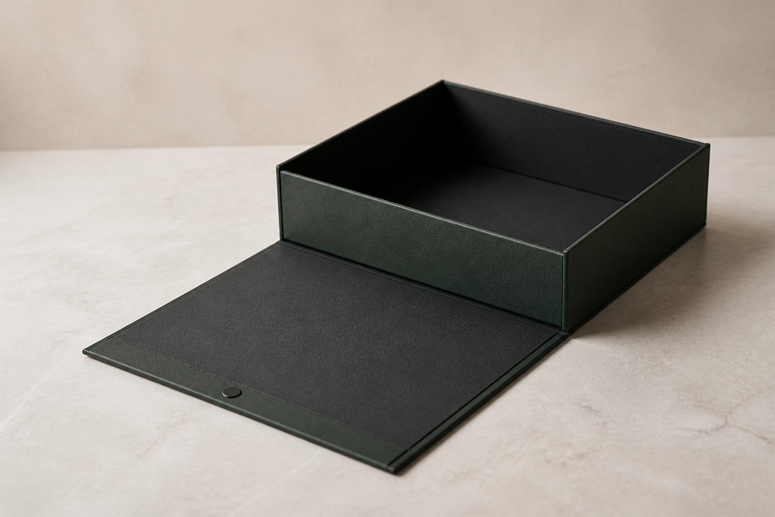 A rigid box with its magnetic flap lid opened flat, showing the interior.